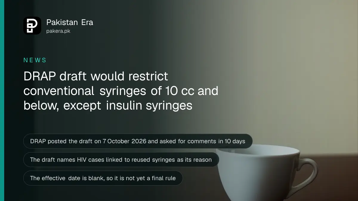 A plain white ceramic cup on a dark wooden table against a cream wall, for an article on the DRAP draft syringe guidance