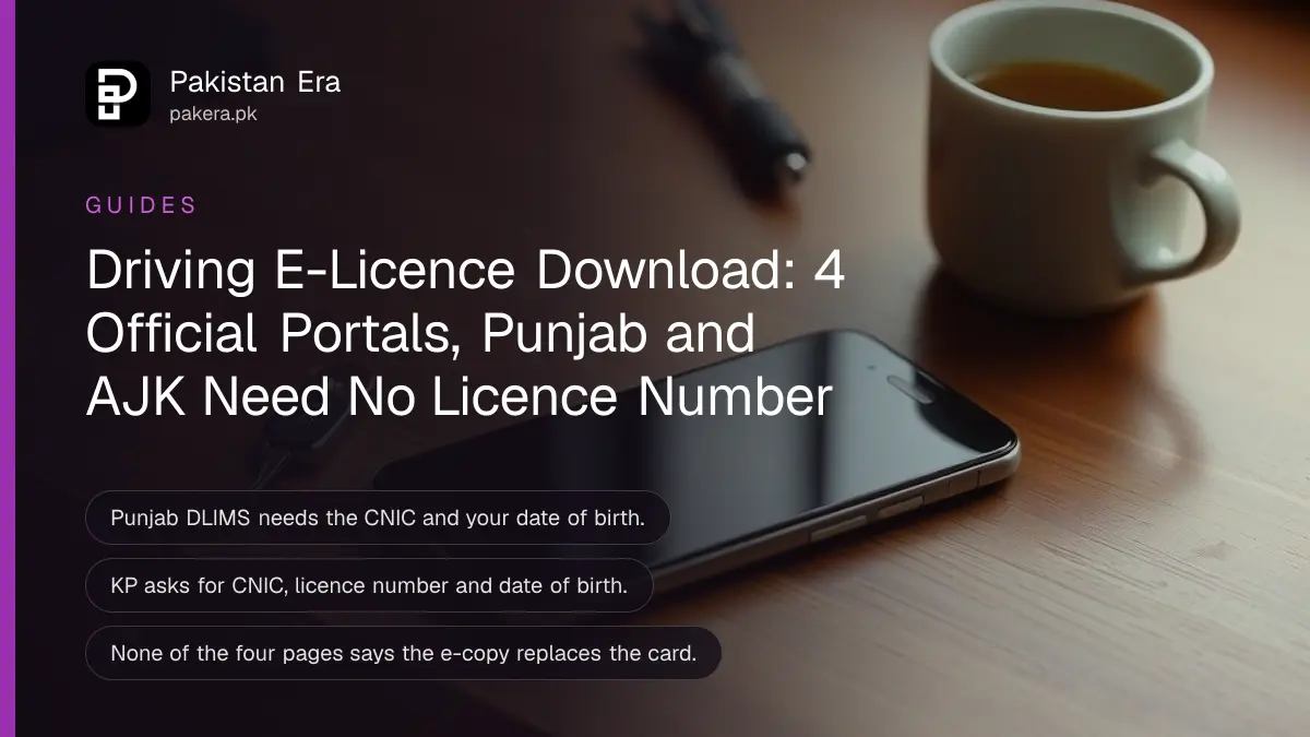 A smartphone lying face up on a wooden desk with its screen dark, a car key and a cup of tea beside it