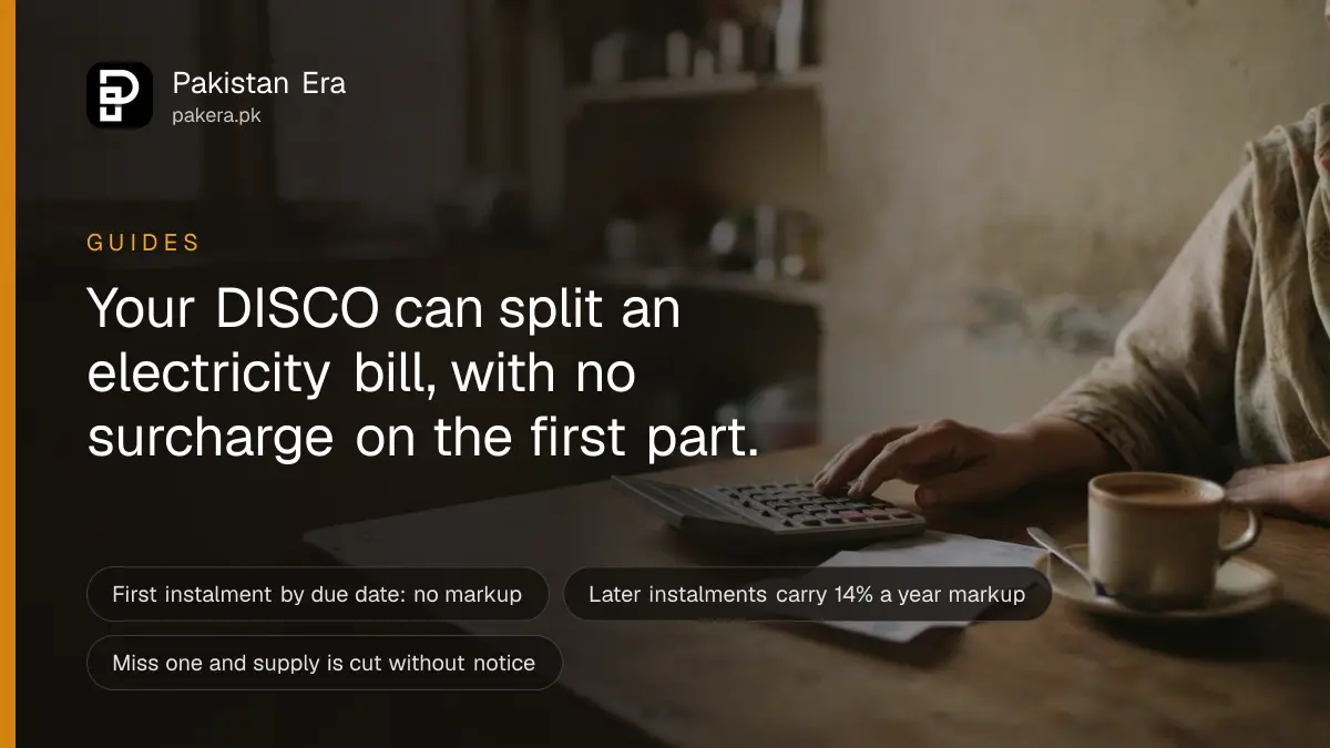 A folded paper utility bill and a calculator on a kitchen table in a Lahore home