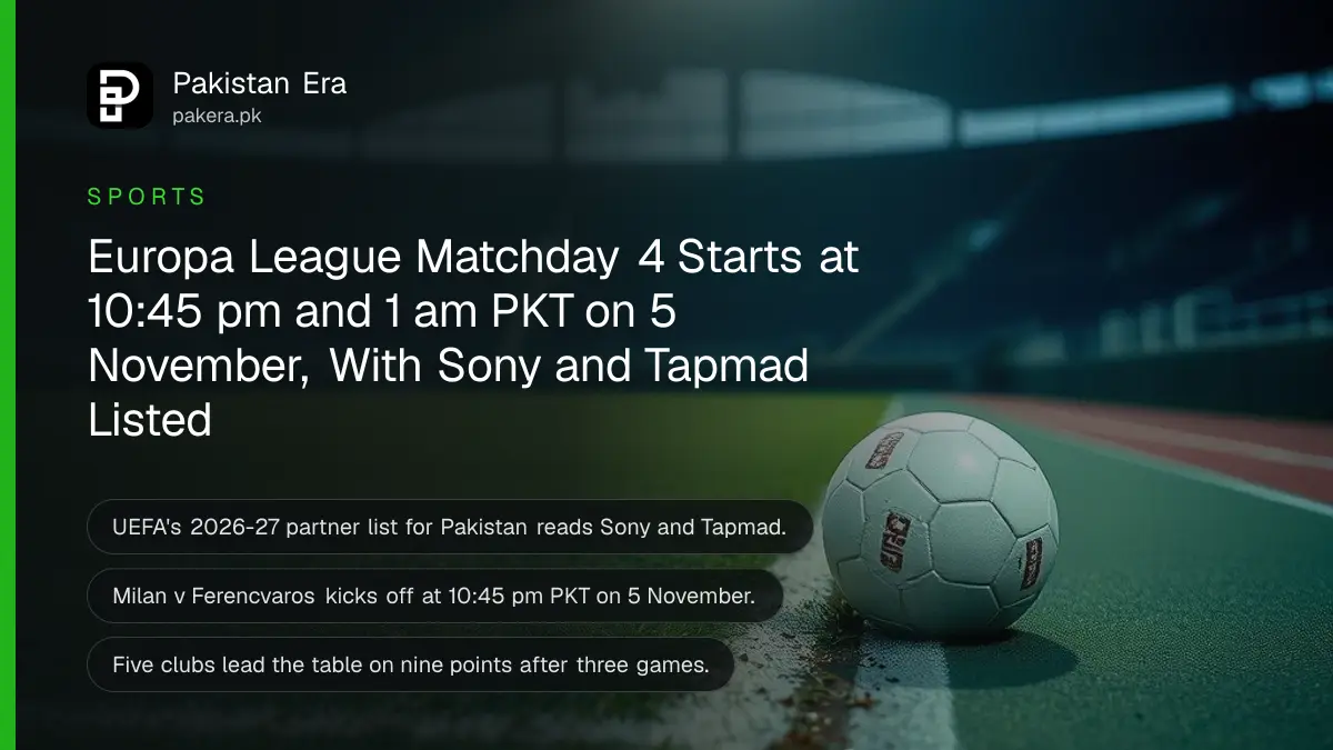 A white football on wet floodlit grass beside a painted line on a misty evening