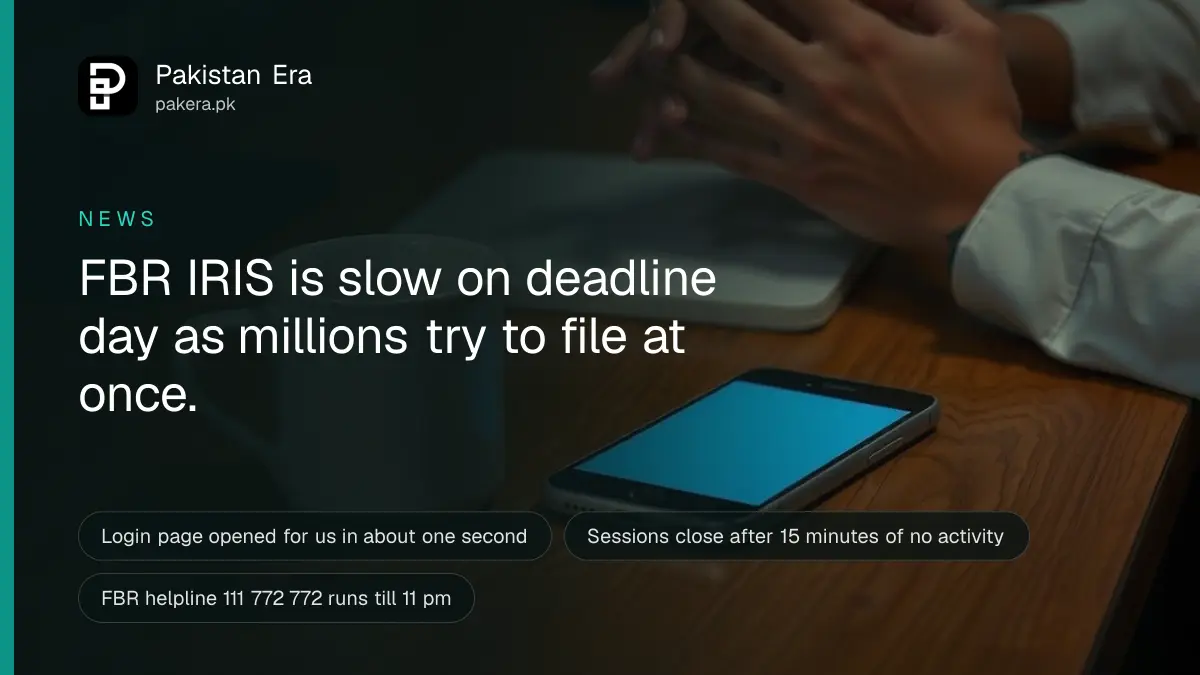 Hands folded on a desk at night in the blue glow of a screen, waiting for a page to load