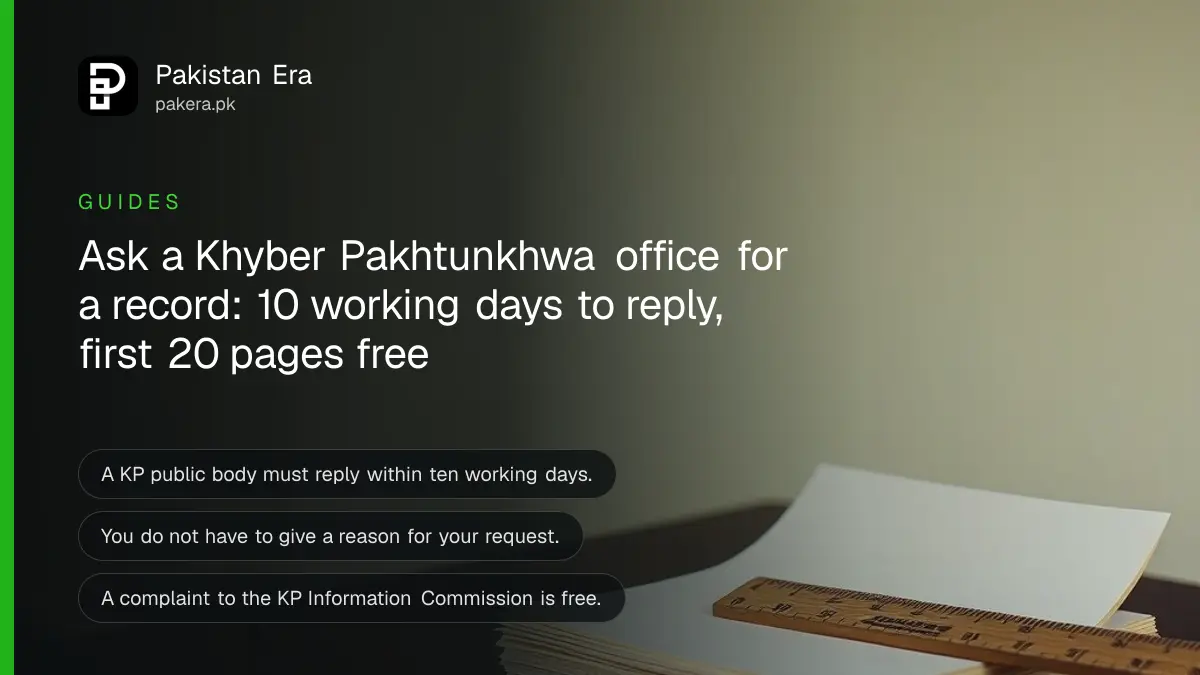 Plain paper sheets and a wooden ruler on a table, for a guide to filing a right to information request in Khyber Pakhtunkhwa