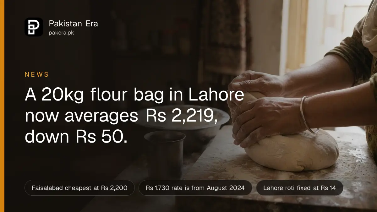 Hands kneading soft wheat dough on a floured wooden board in a home kitchen in Lahore