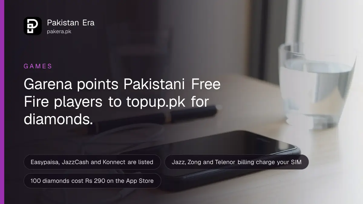 A black smartphone lying face down on a wooden study desk beside wired earphones and a glass of water in Karachi