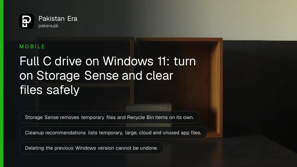 An empty shelf and a small cardboard box on a dark wooden table, for a guide to freeing disk space on Windows