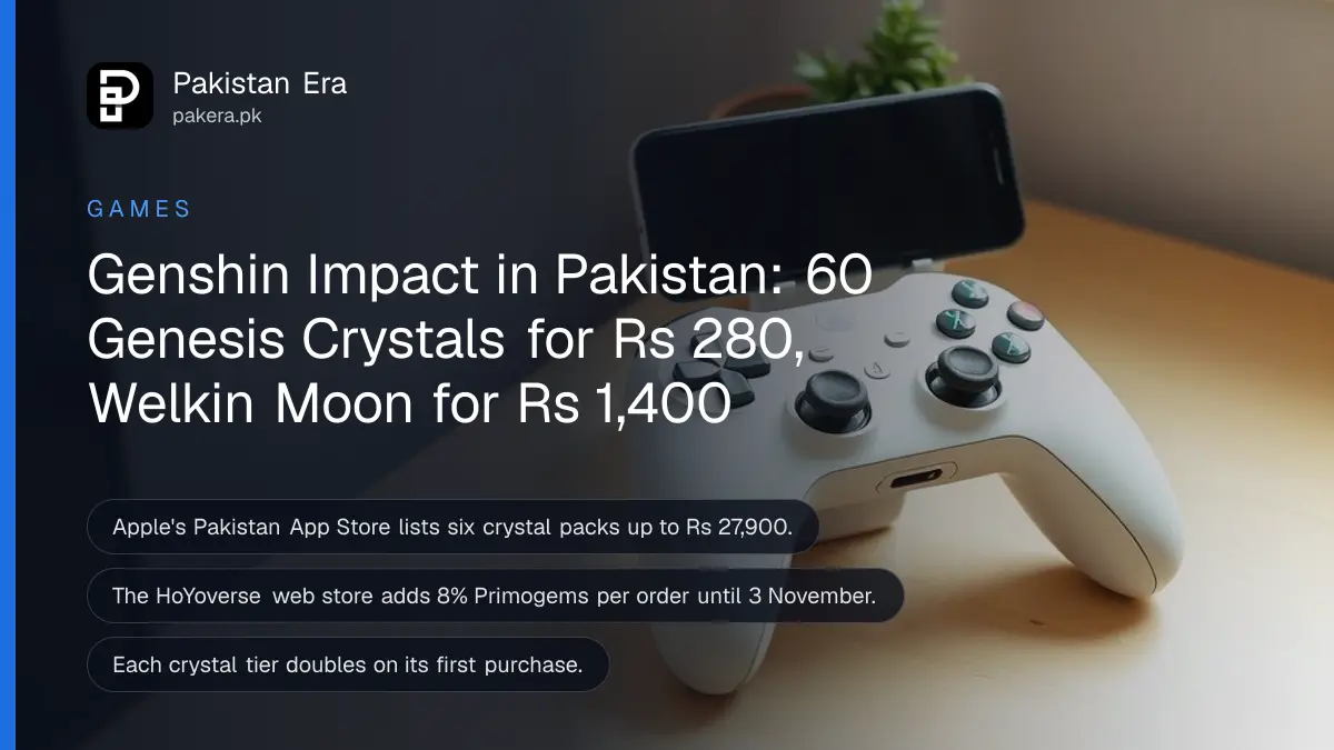 A white game controller and a smartphone in a stand on a light wooden desk beside a small potted plant in morning light