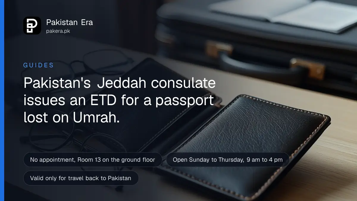 An open empty travel wallet and a pair of reading glasses on a hotel desk beside a small suitcase