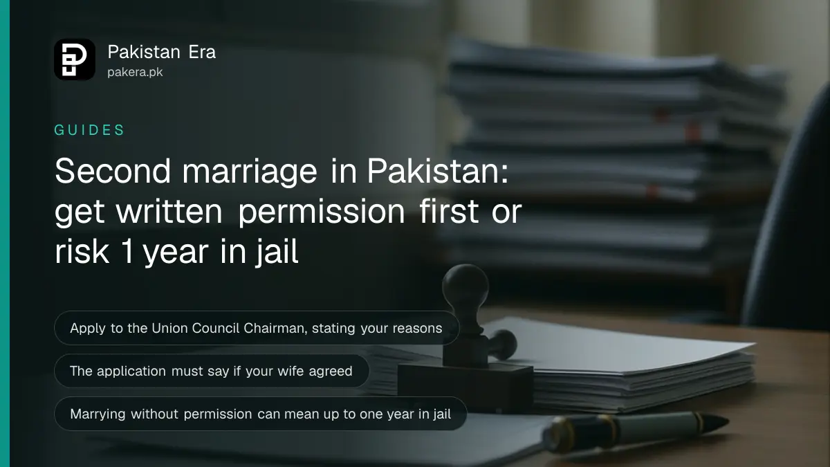 A closed wooden office desk with a stack of papers, a stamp pad and a pen in a quiet government office in Pakistan