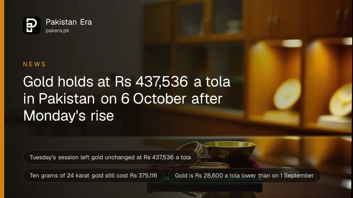 A glass jewellery counter with a brass weighing pan and gold bangles in a warmly lit Lahore shop