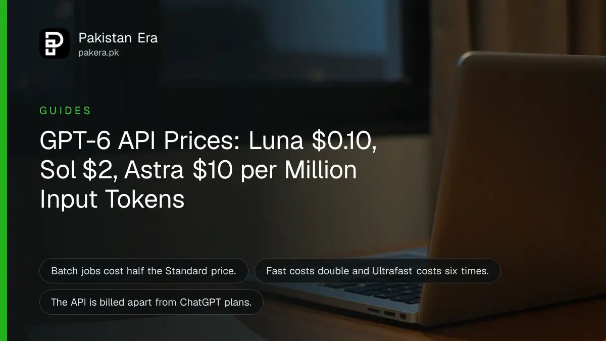 An open laptop on a wooden table by a window at dusk