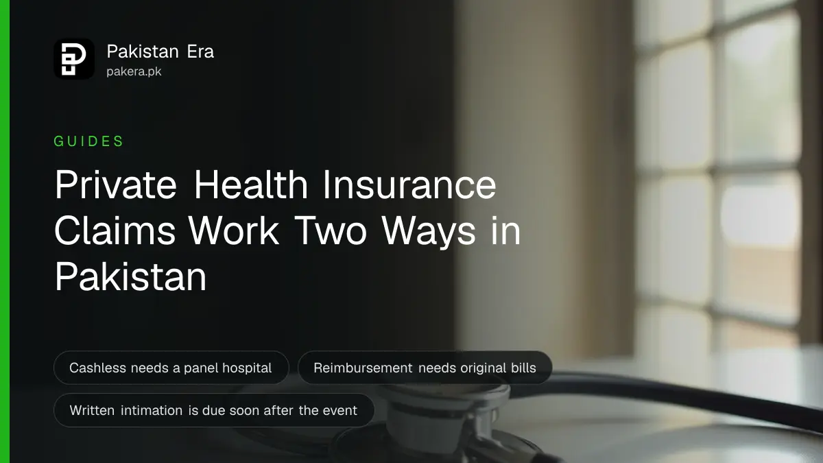A patient's hand holding a health insurance card at a hospital reception desk, face out of frame