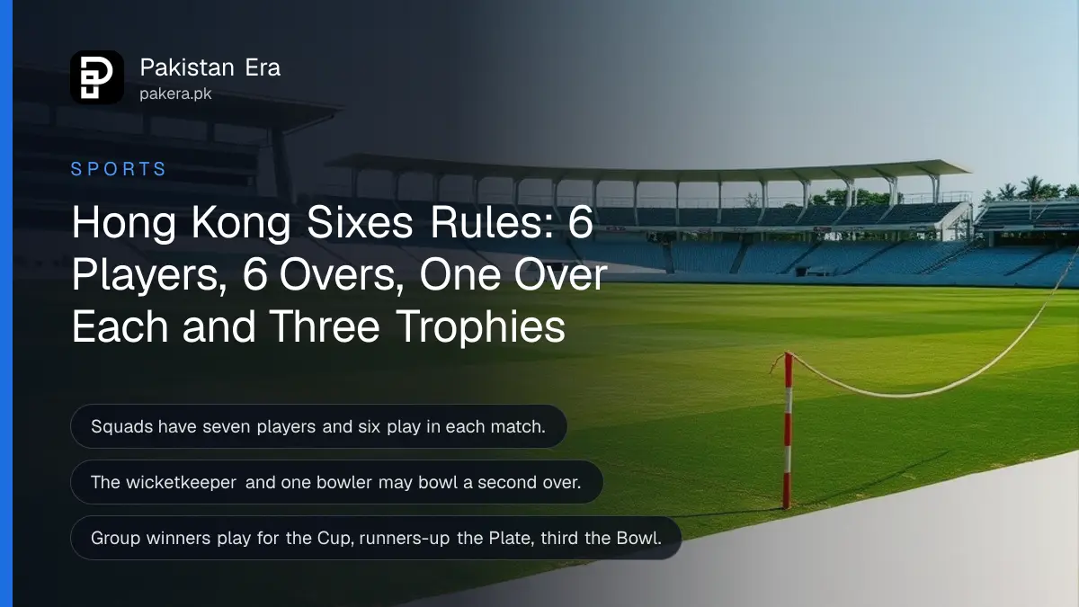 A green cricket outfield with a boundary rope and empty white seats under a blue sky