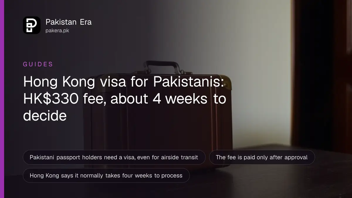 A small suitcase on a dark wooden table, for a guide on hong kong visa from pakistan