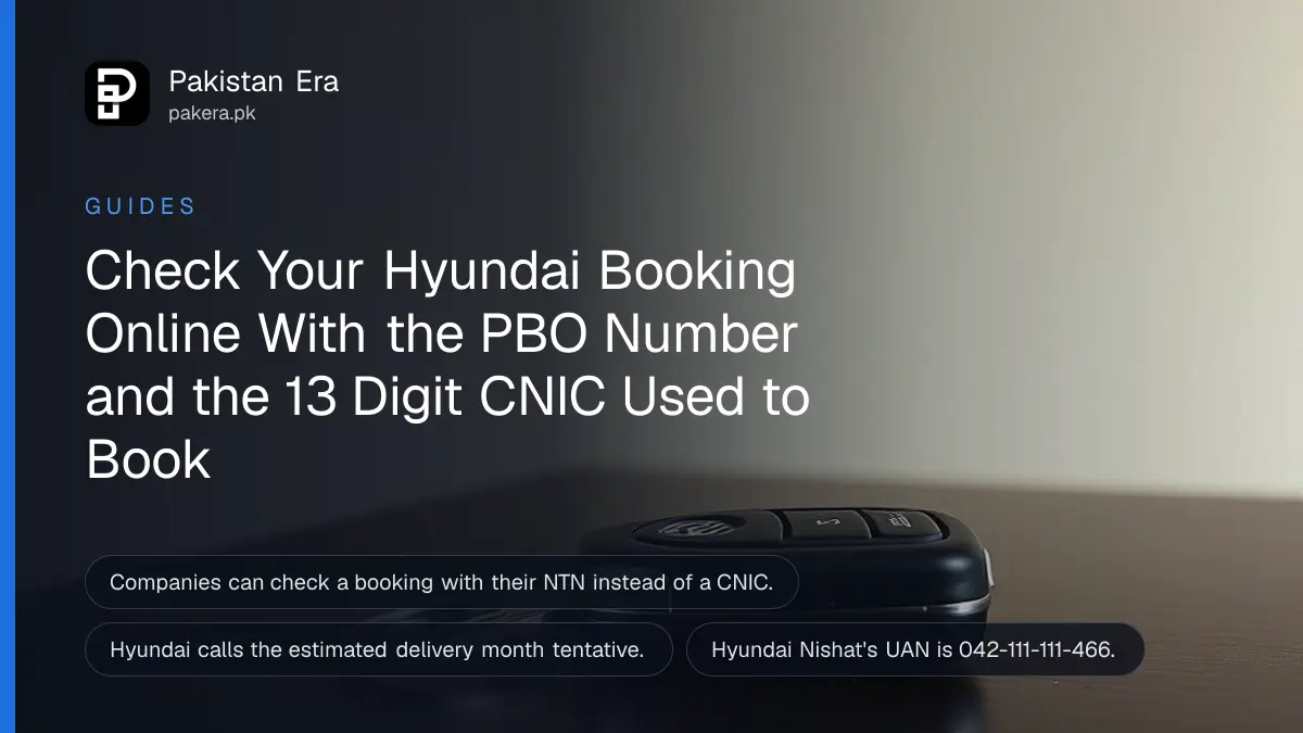 A silver car key on a dark table, for checking a Hyundai booking status