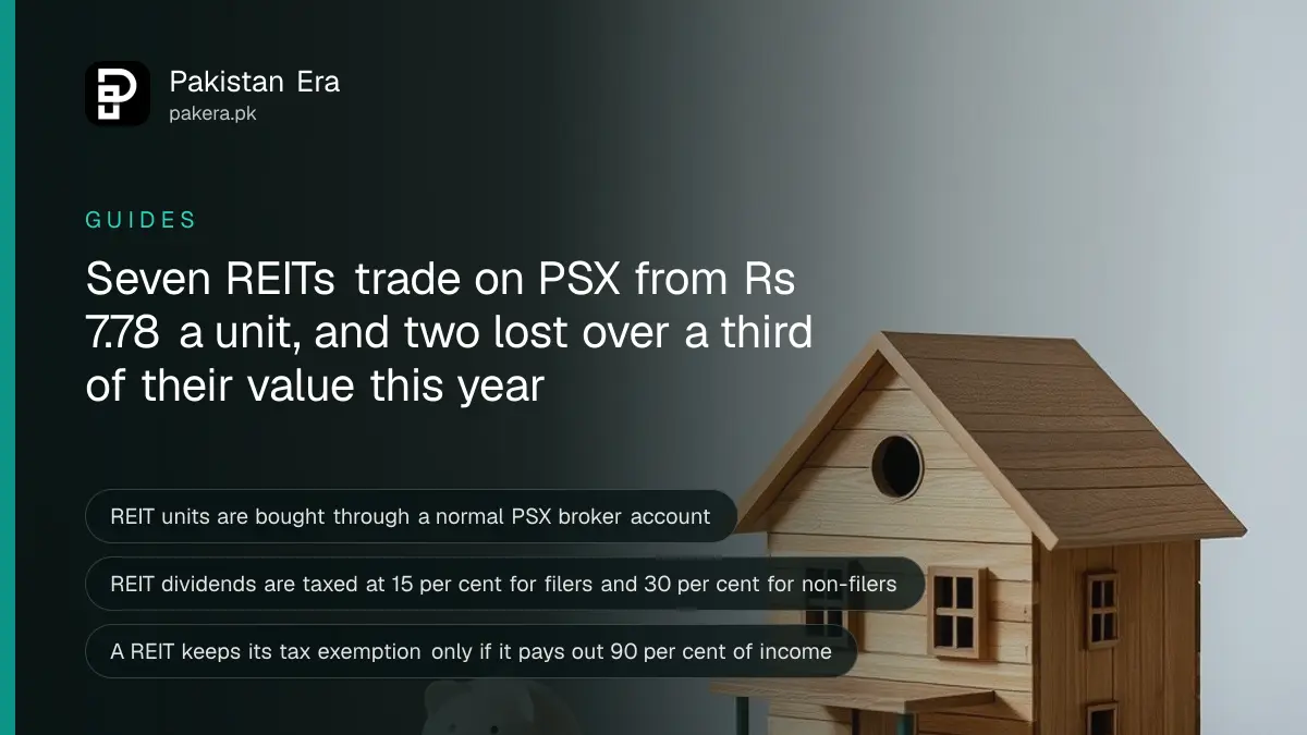 A small wooden house model and a piggy bank on a table