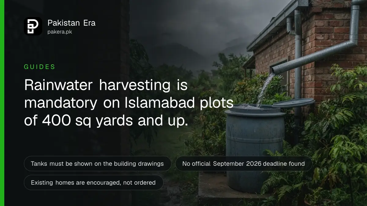 Rainwater flowing from a roof gutter pipe into a storage tank in a green garden in Islamabad