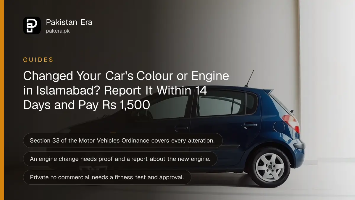 A freshly painted dark blue car seen side on inside a bright, clean garage