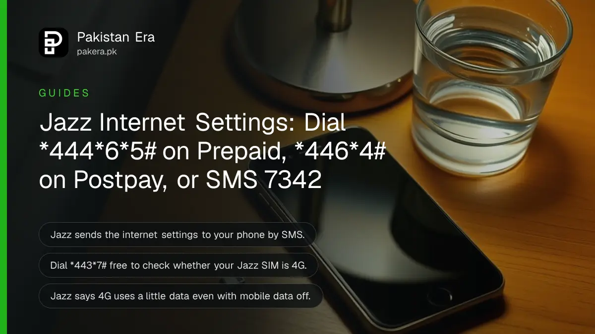 A smartphone lying face up on a bedside table at night beside a small SIM ejector pin and a glass of water