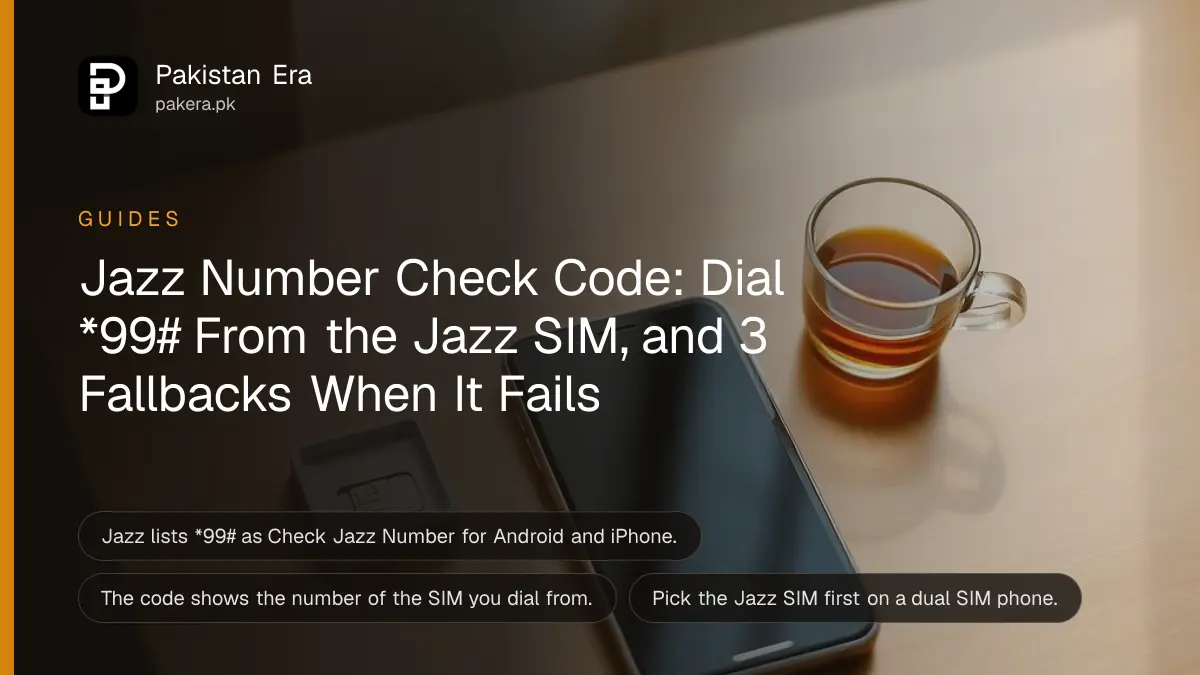 A smartphone lying face up on a wooden desk with its screen dark, a small SIM card tray and a cup of tea beside it