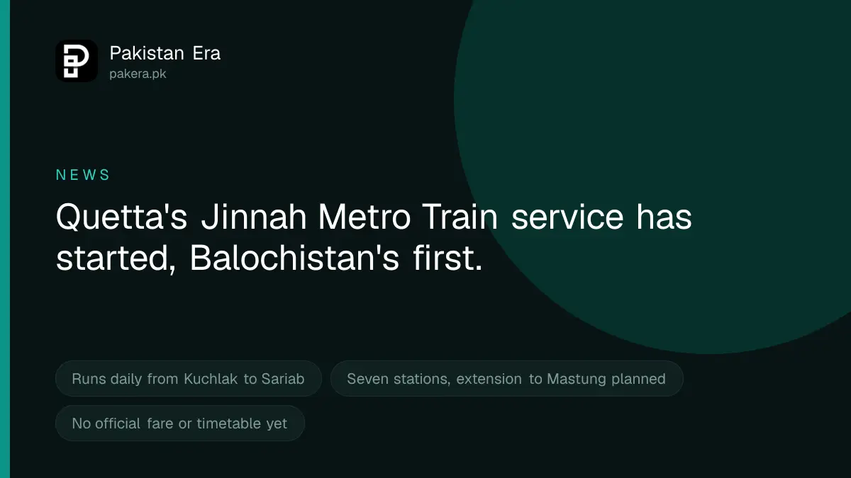 An empty railway platform in Quetta at dawn with the track curving towards brown mountains