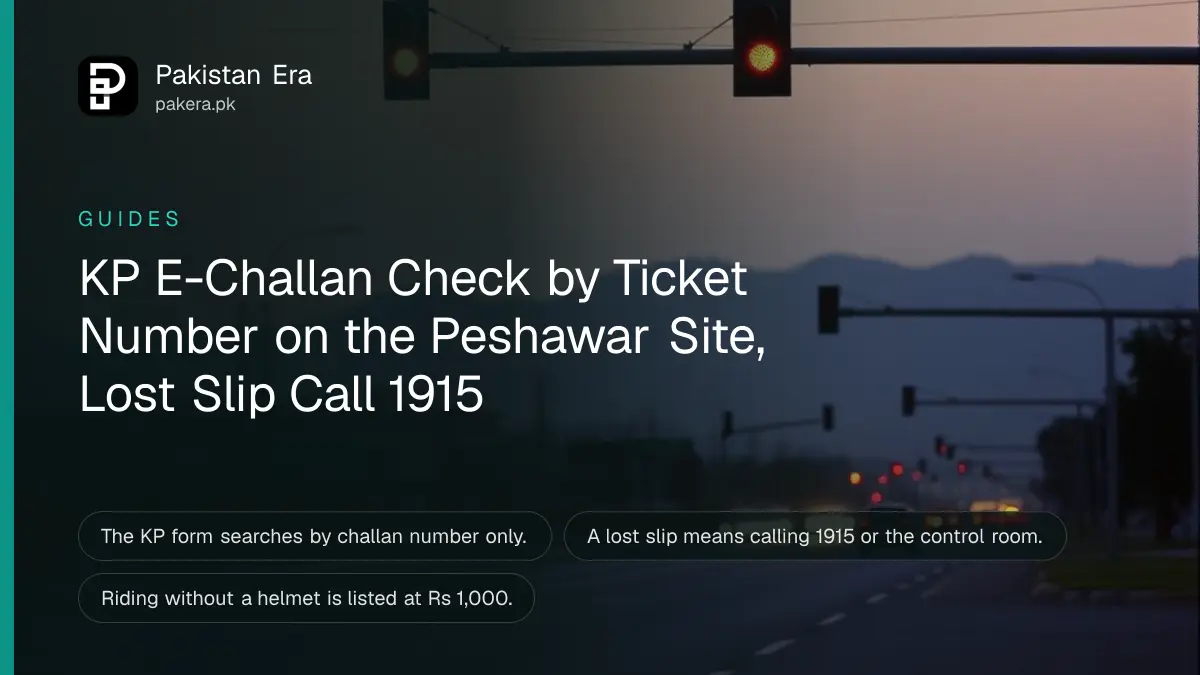 Traffic lights over a city road at dusk
