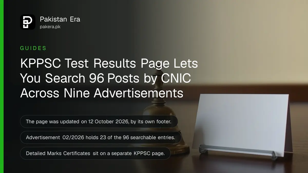 A small brass bell and a white card on a wooden table, for a guide to checking KPPSC test results by CNIC