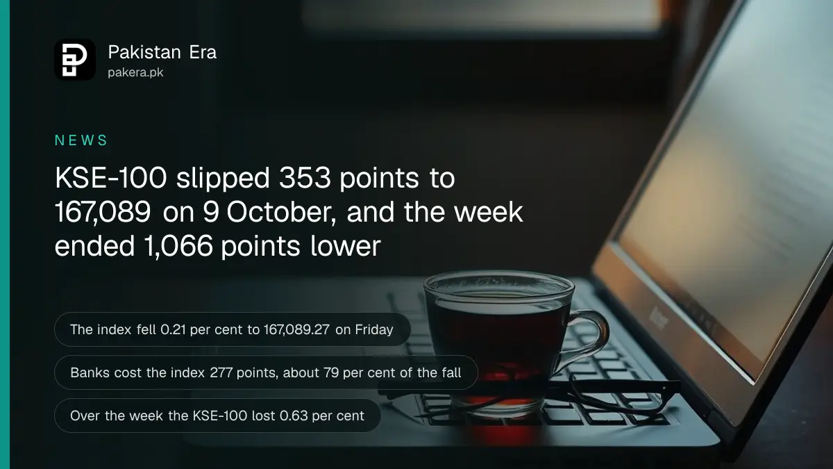 A closed laptop, a cup of tea and glasses on a desk in the evening