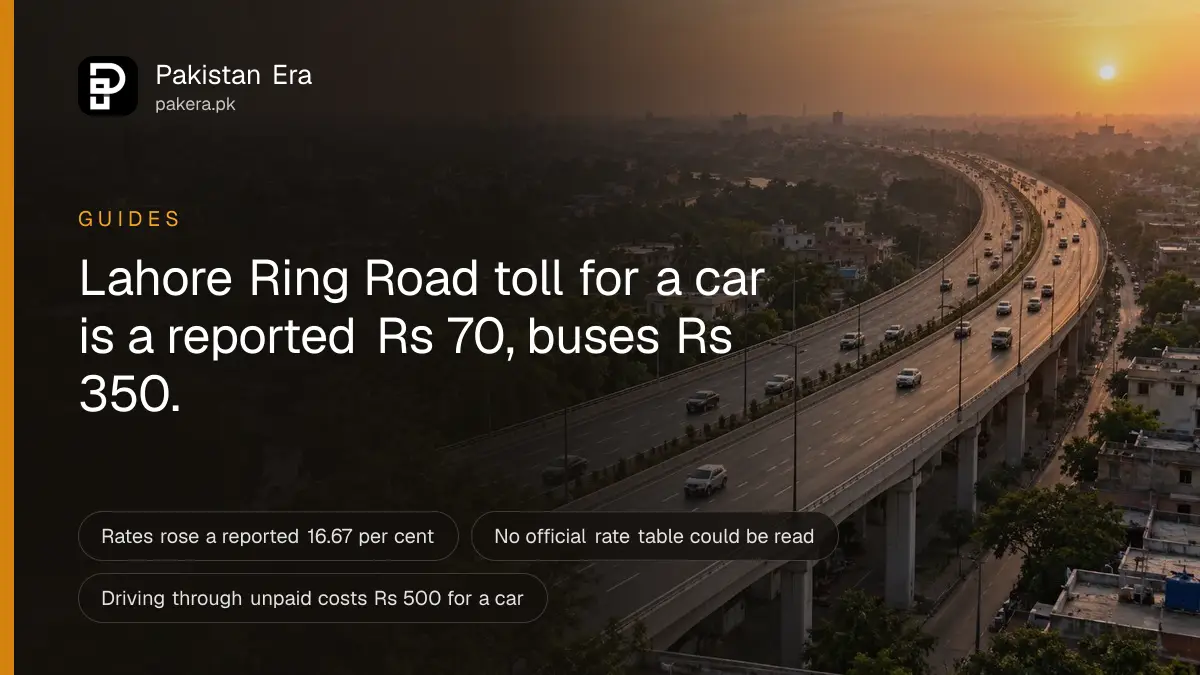 A wide elevated highway curving around the edge of Lahore under a hazy evening sky