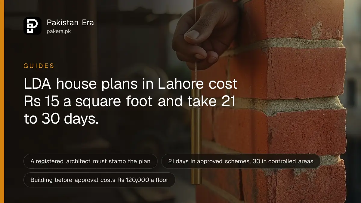 A builder's hand holding a plumb line against a new brick wall on a house site in Lahore