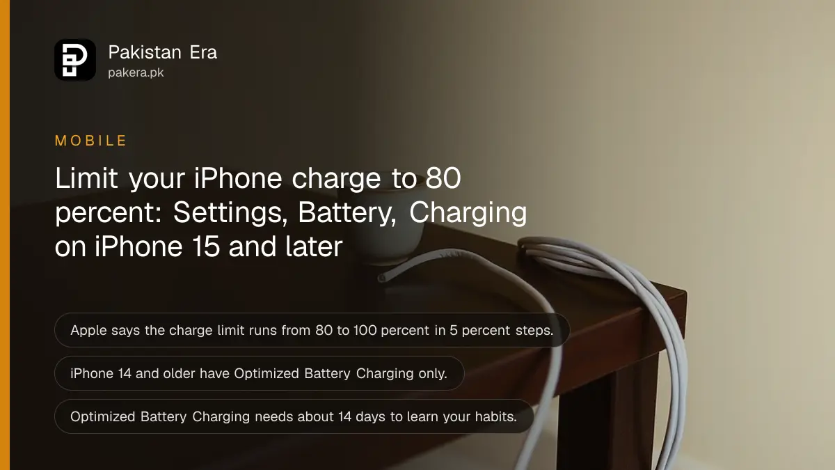 A coiled white cable and a ceramic cup on a dark wooden table, for a guide to the iPhone charge limit in Pakistan