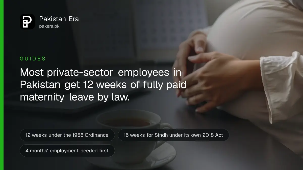 A pregnant employee reviewing a leave policy document at a private office desk in Pakistan