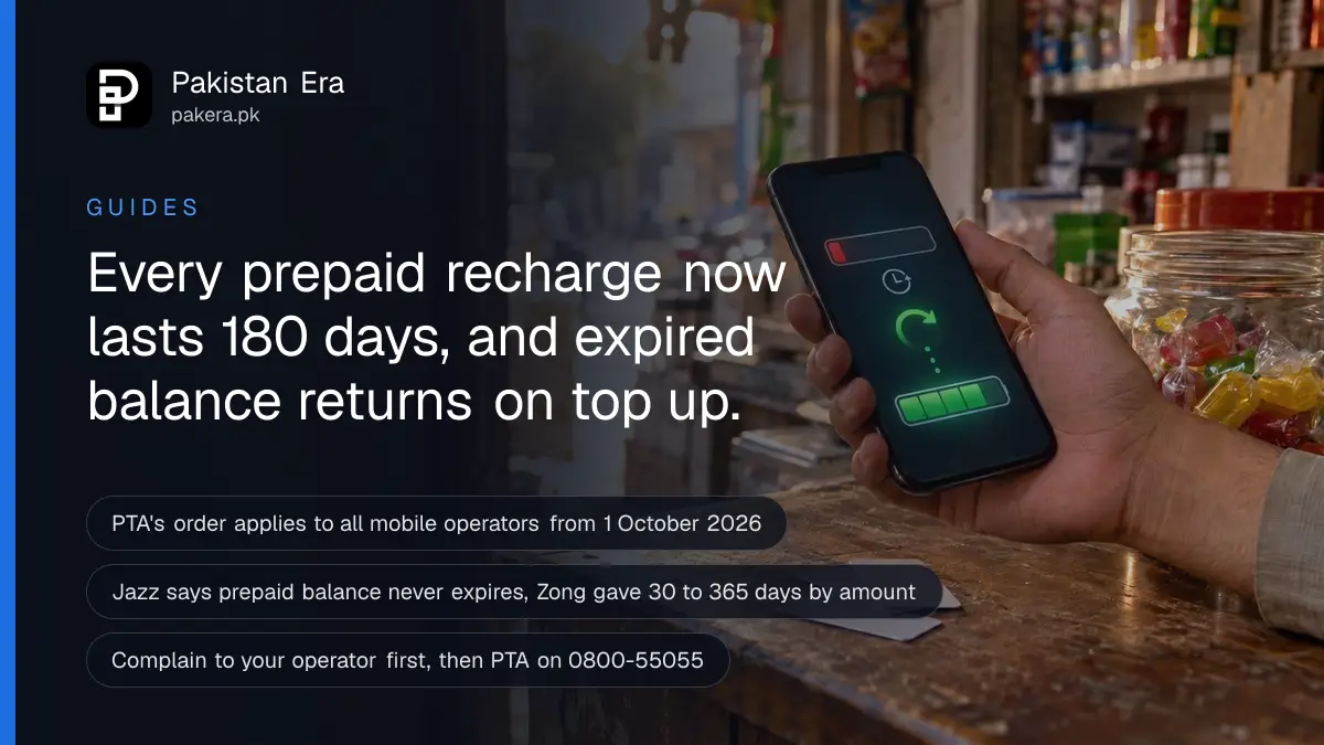 A hand holding a smartphone over a small shop counter with prepaid top-up cards, illustrating how to restore expired mobile balance in Pakistan