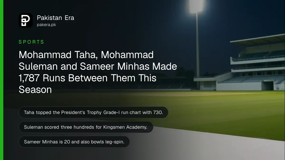 An empty cricket stadium under floodlights at dusk
