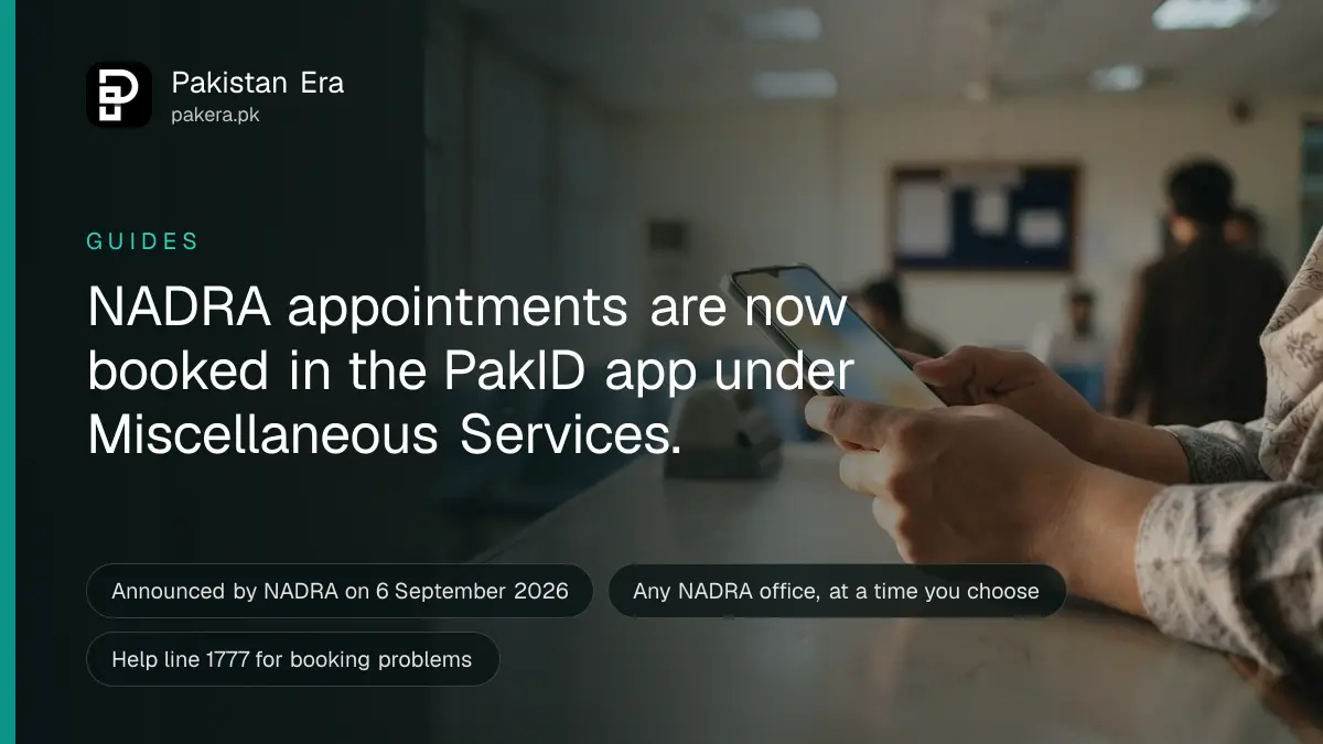 A person's hands holding a smartphone near a service counter while booking a NADRA appointment, the screen unreadable