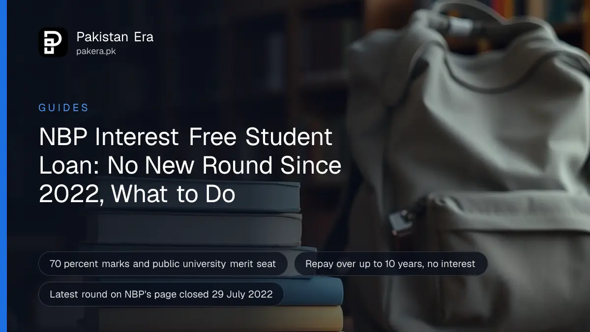 A stack of plain hardback textbooks and a canvas backpack on a library table in soft daylight