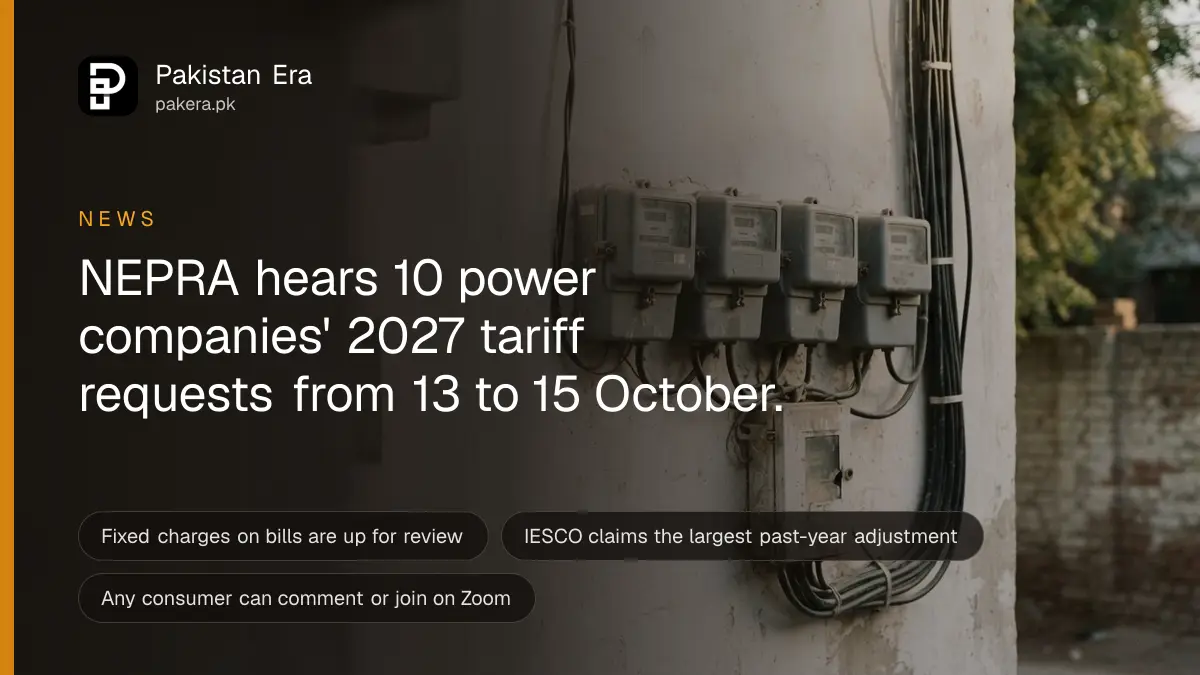 A row of grey electricity meters on a plain wall in soft afternoon light