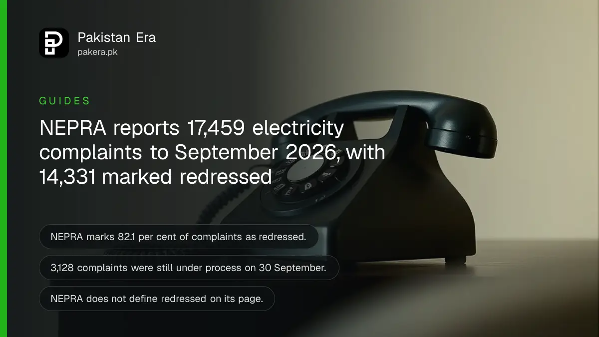 A rotary dial telephone receiver on a dark wooden table, for a story on electricity complaints in Pakistan