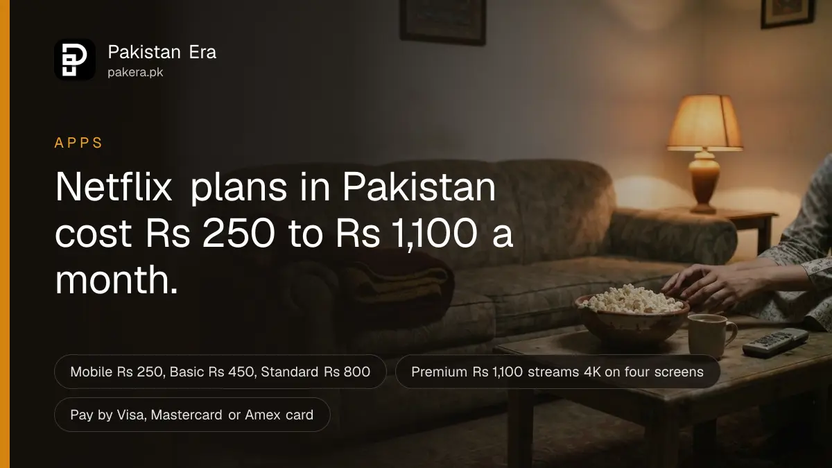 A sofa with a folded blanket and a bowl of popcorn in a dim Lahore living room lit by a table lamp