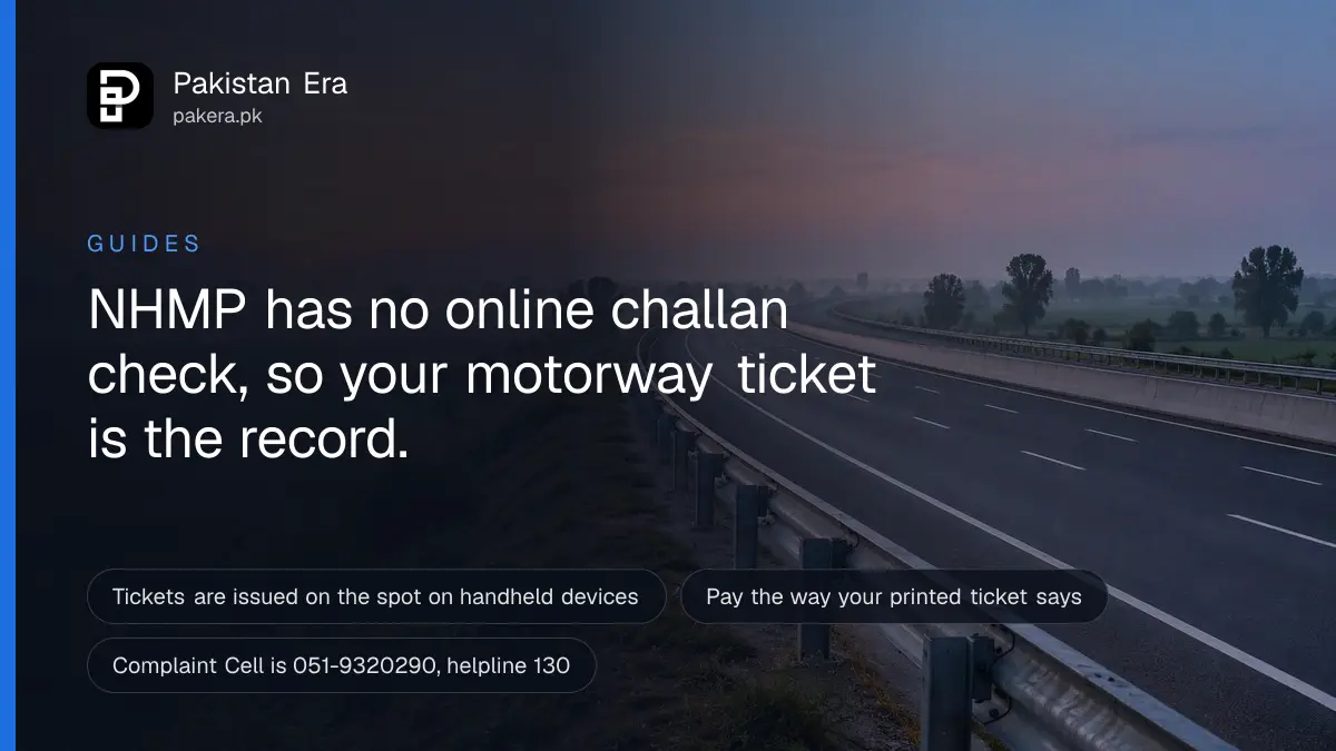 An empty motorway at dawn with a steel guard rail and soft mist over green fields