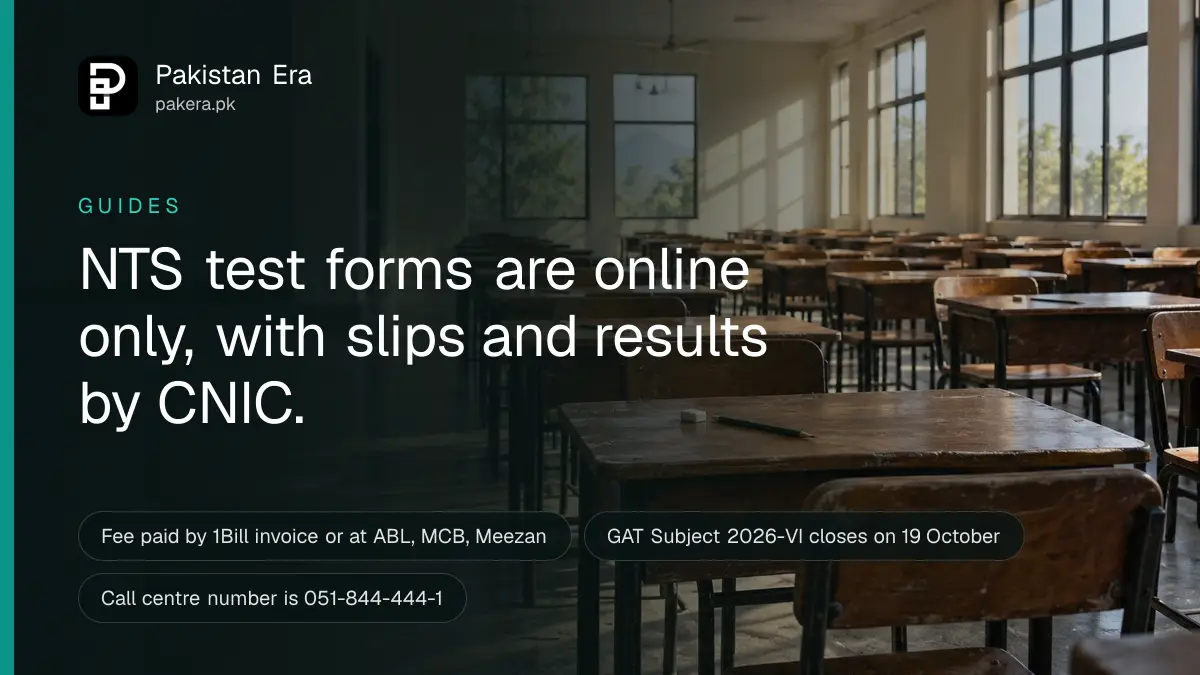 Rows of empty wooden desks in a quiet exam hall with soft morning light from tall windows