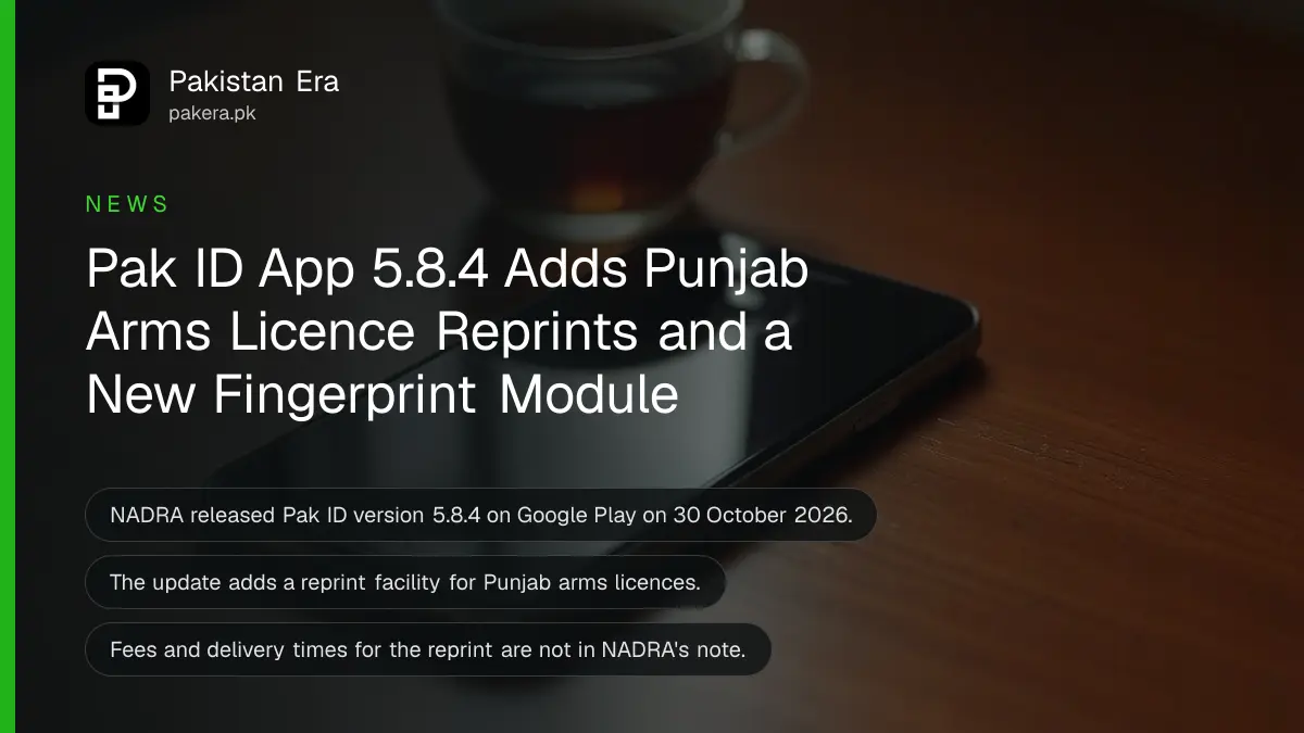 A smartphone lying face up with its screen dark on a wooden desk beside a cup of tea in morning light