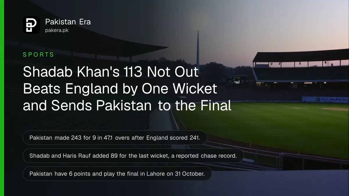 An empty cricket stadium at dusk with floodlights on over a green outfield