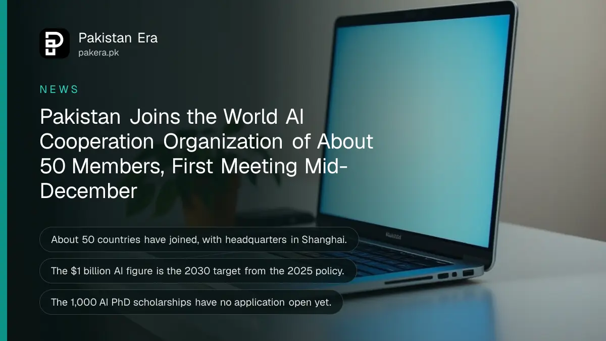 A silver laptop with a softly glowing screen on a tidy desk beside a plant