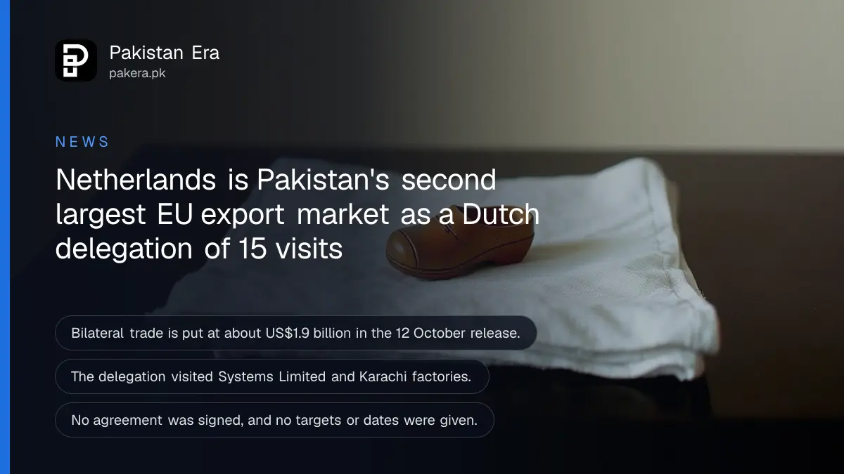 Folded cotton cloth and a wooden clog ornament on a dark wooden table, for a report on Dutch business delegation visiting Pakistan
