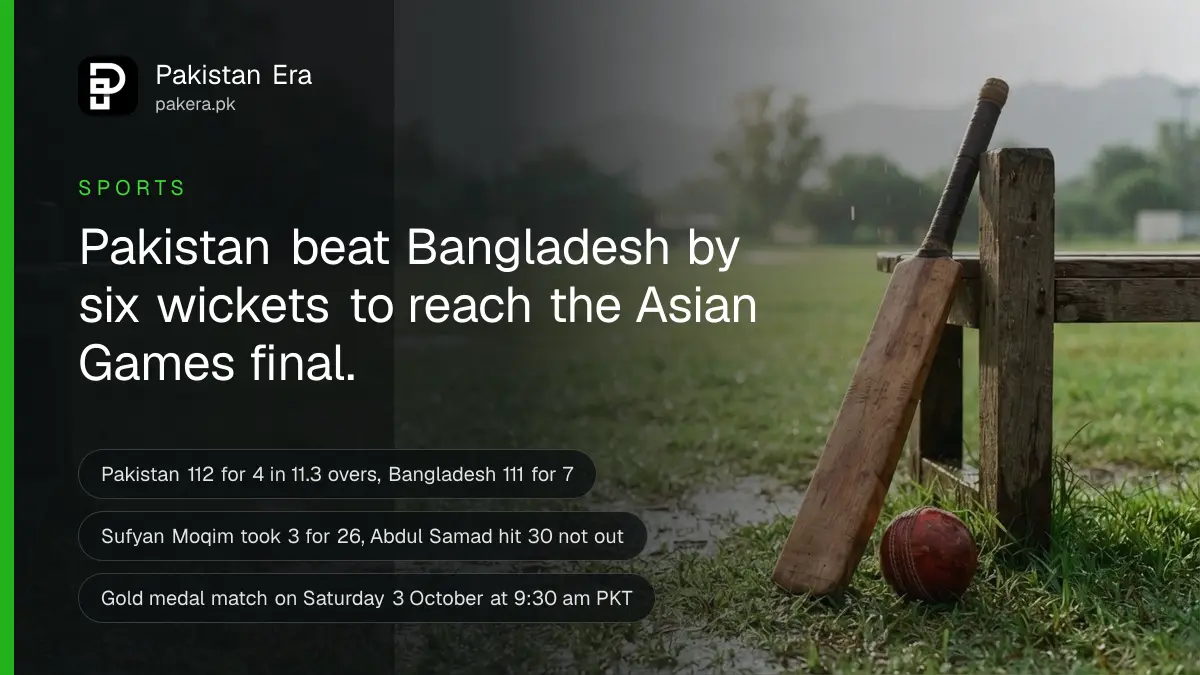 A cricket bat leaning against a wooden bench beside a red ball on wet green grass, in bright morning sunshine after rain