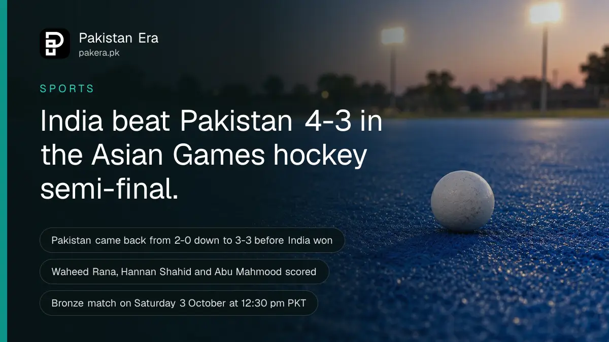 A wooden field hockey stick lying on blue artificial turf beside a white hockey ball near a white painted line