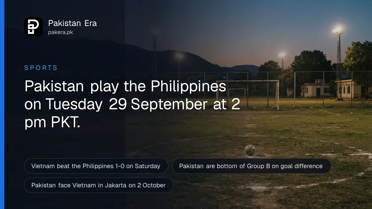An empty football pitch under floodlights at dusk in Pakistan