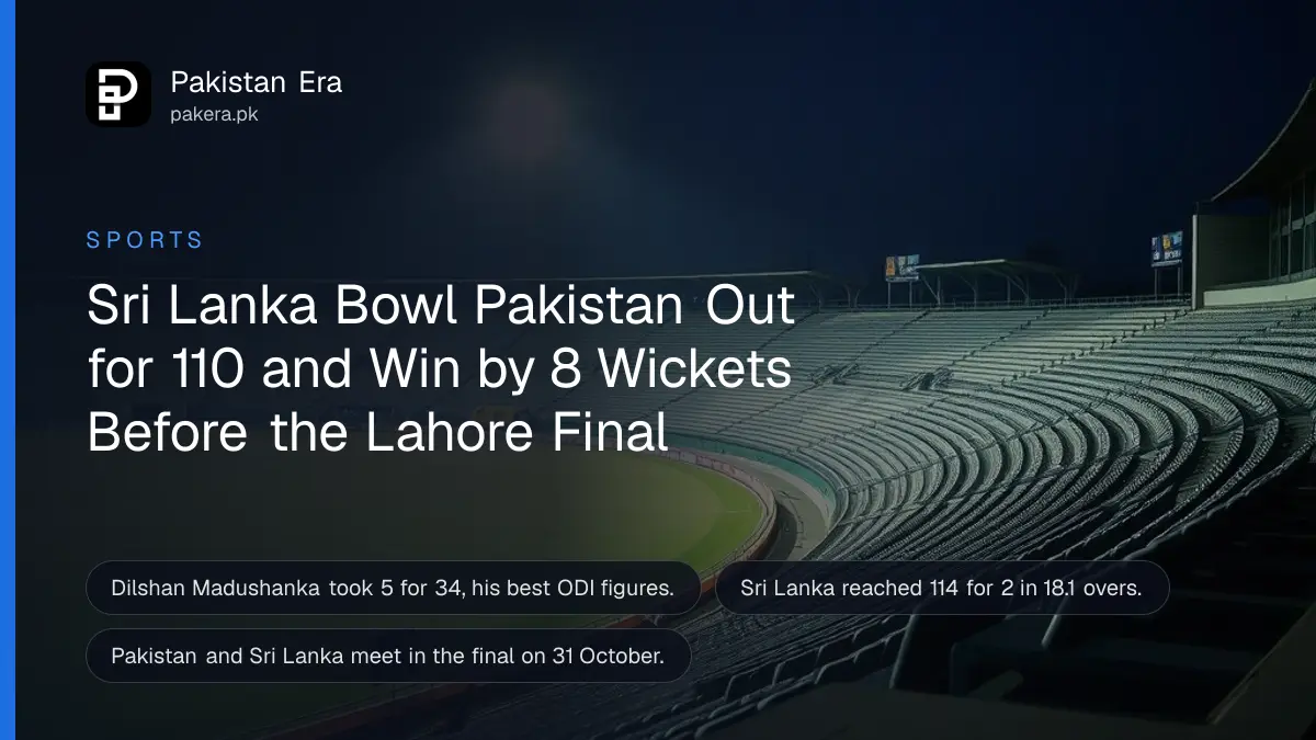 An empty cricket stadium at dusk with floodlights on over a green outfield and empty seats