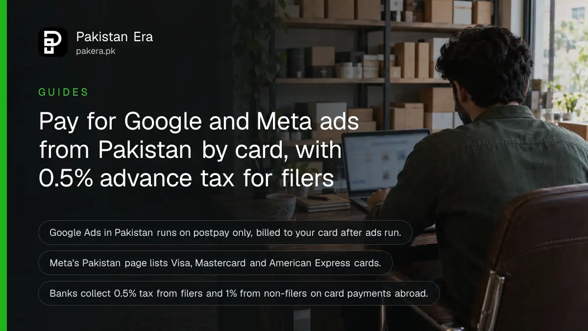 A small business owner in a Lahore office working on a laptop beside a bank card and a cup of tea