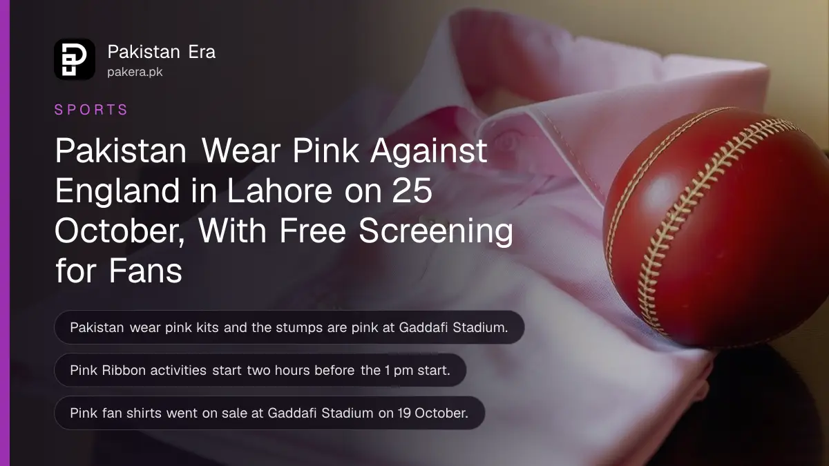 A folded pink cotton shirt beside a red cricket ball on a dark wooden table, for Pakistan's pink ODI against England in Lahore